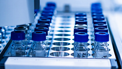 A rack of High-Performance Liquid Chromatography vials at an analytical pharma lab